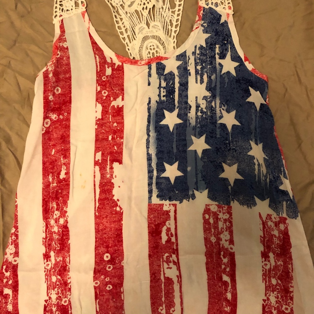 Cute summer top especially for the 4th of July but has crochet type of straps .